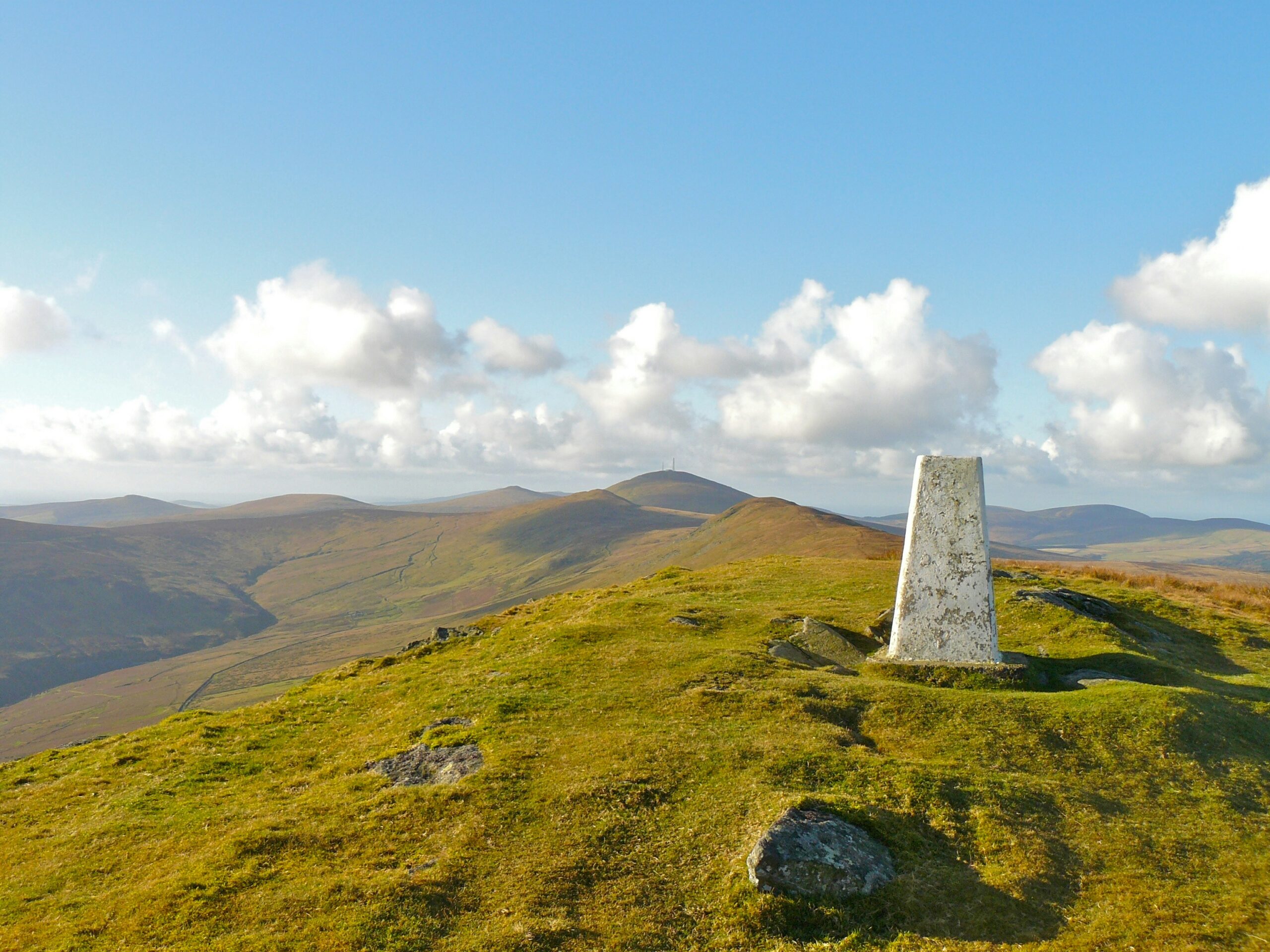 white tombstone on hill