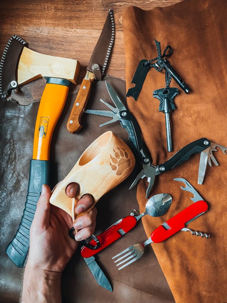 Comprehensive display of essential camping and survival tools in a flat lay arrangement.