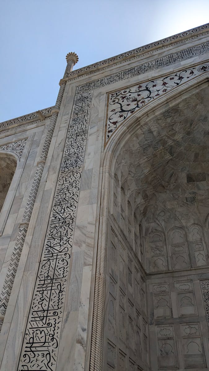 Detailed view of the Taj Mahal's exquisite marble architecture in Agra, India.