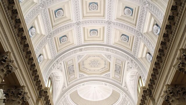 Stunning view of the detailed ornate ceiling in the Basilica of San Marino, showcasing intricate architecture.