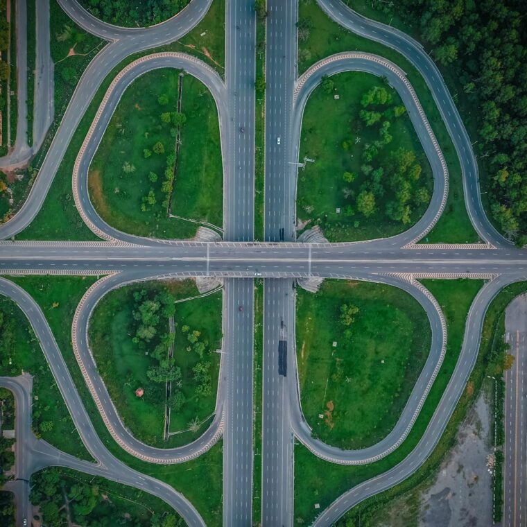 A stunning aerial capture of a highway interchange in Islamabad, showcasing symmetry and greenery.