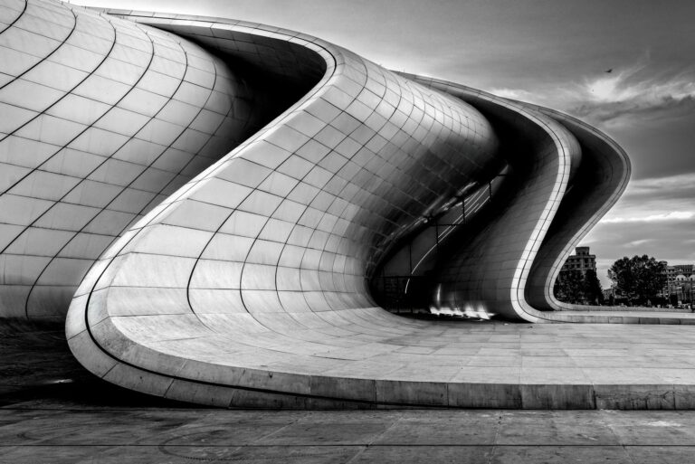 Explore the iconic curves of modern architecture in Baku, showcasing contemporary design in grayscale elegance.