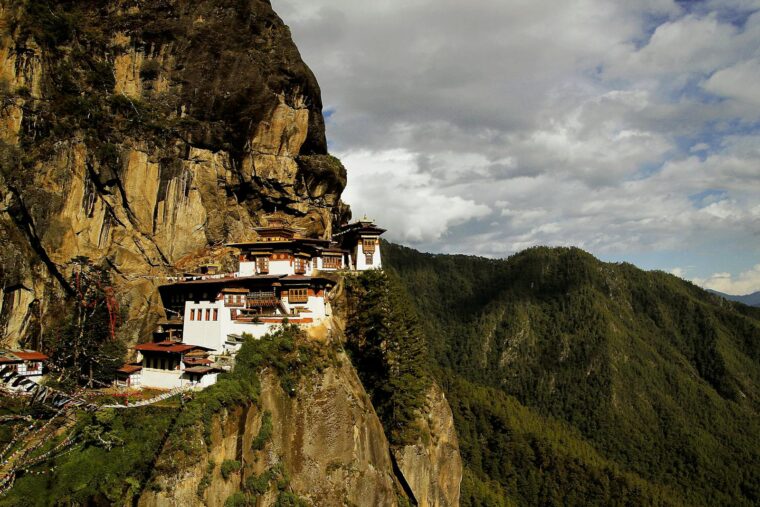 Majestic Taktsang Monastery nestled on steep cliffs in Bhutan, offering stunning natural views.