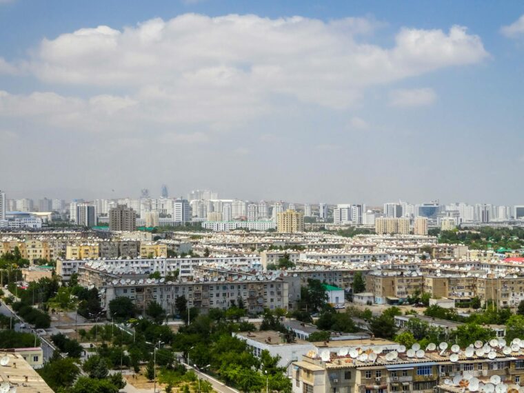 A vibrant aerial view of Ashgabat showcasing modern architecture and residential areas.