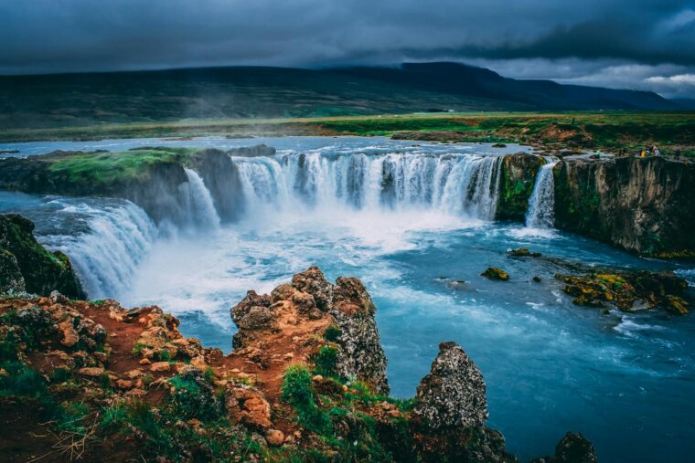 Discover the breathtaking beauty of Godafoss waterfall cascading in Iceland's stunning landscape.