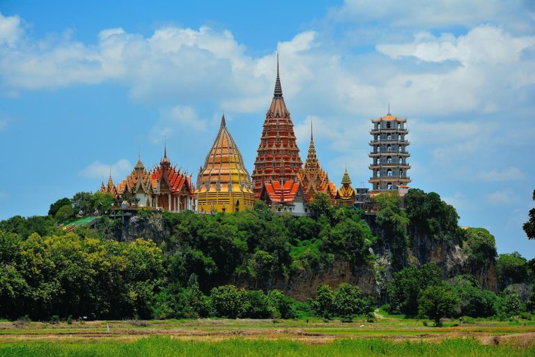 Stunning view of Wat Tham Suea temple in Thailand surrounded by lush greenery.