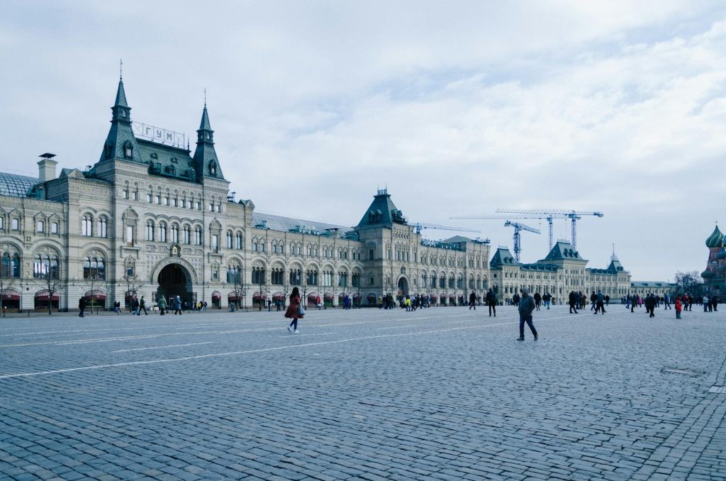 Historic GUM department store facade at Red Square under a cloudy sky, Moscow, Russia.